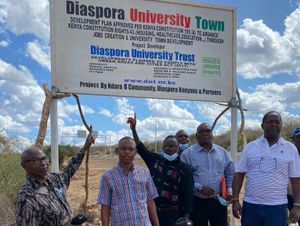Diaspora Kenyans Talk at Diaspora University Town Sign.